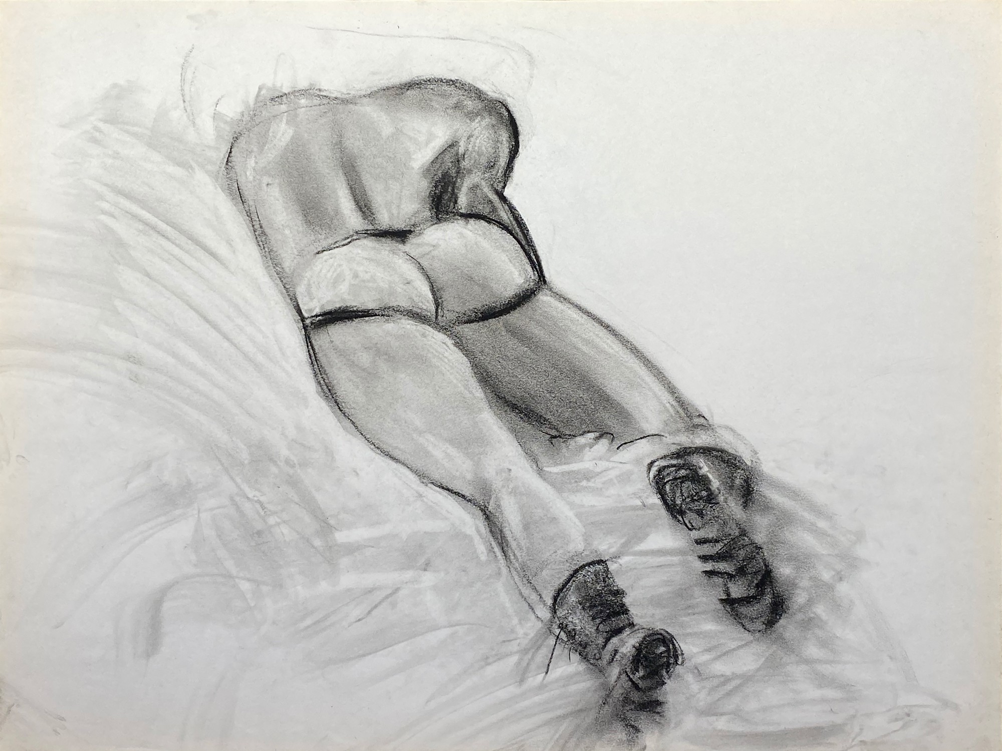 charcoal drawing of male model laying in jocks and boots