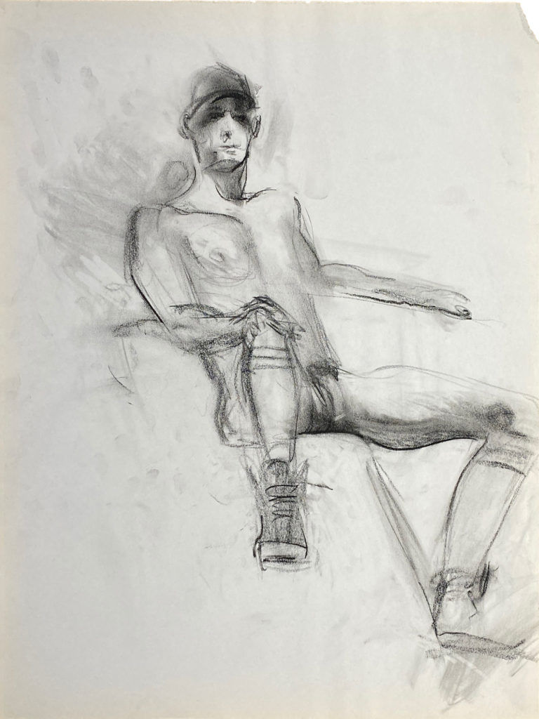 charcoal drawing of nude male model sitting in sneakers, gaiters & baseball cap